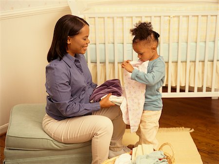 Black mother cleaning the house Stock Photos - Page 1 : Masterfile