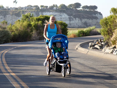 women jogging with baby in stroller